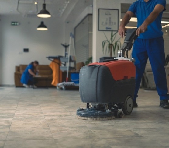 Vcare floor care technician maintaining a commercial floor